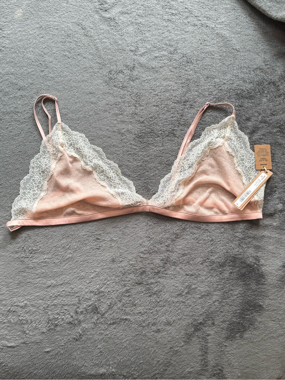 SKIMS Sheer Rib Lace Triangle Bralette in the color villa